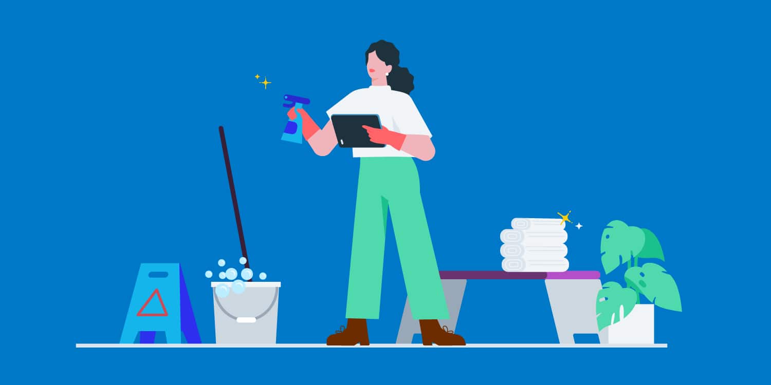 A woman holding a cleaning spray bottle