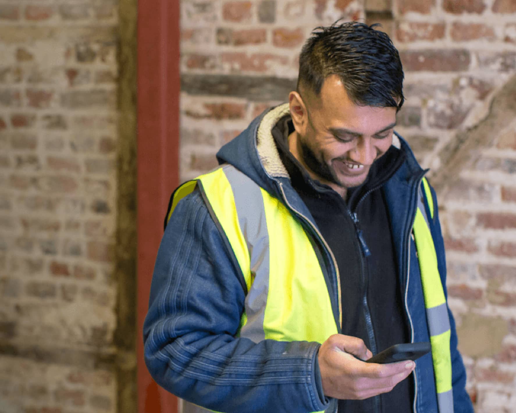 A customer using his phone on site