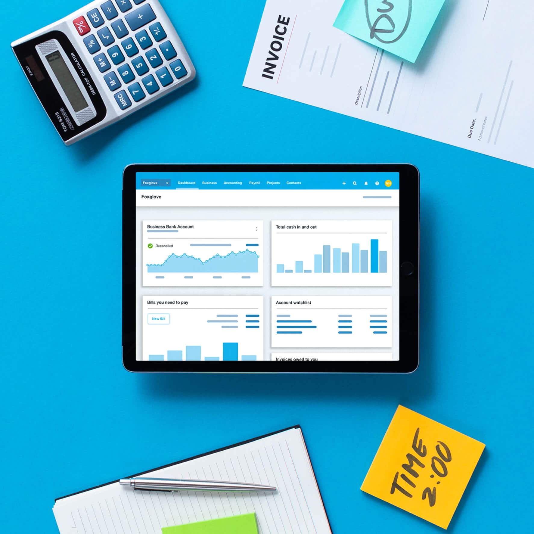 Xero accounting software on a tablet, surrounded by paper files and office stationery. 