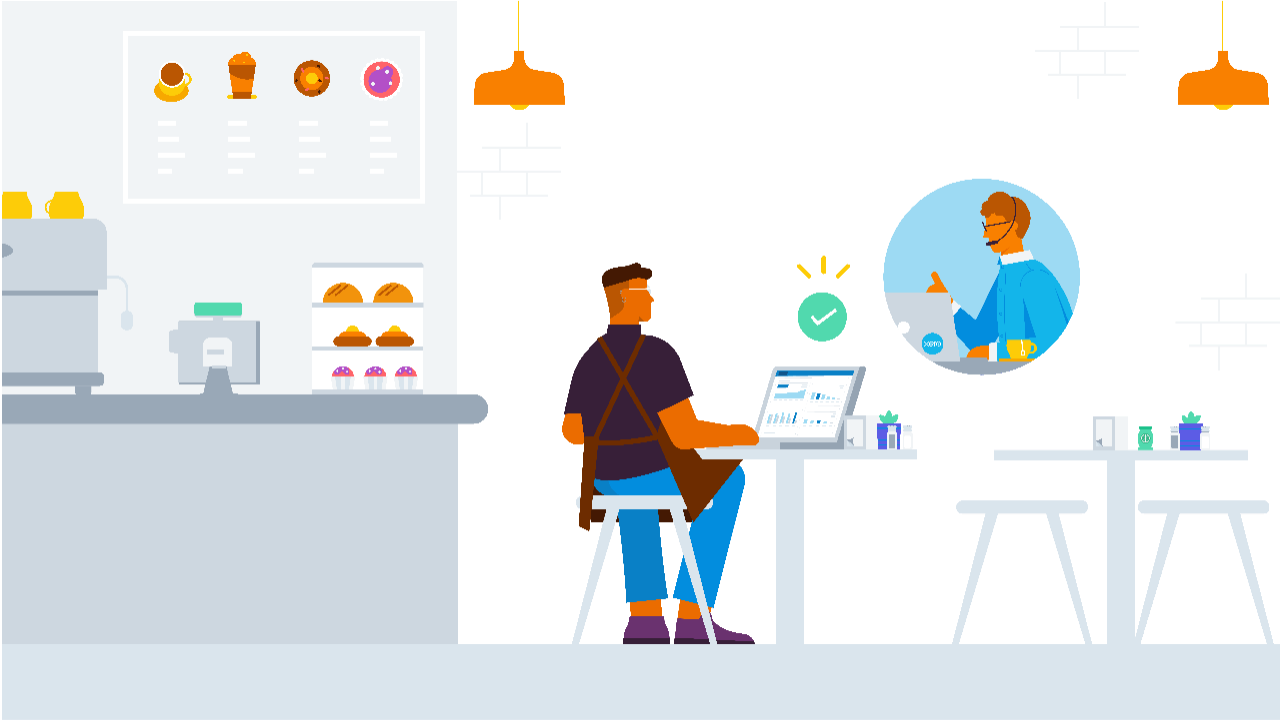 A cafe owner sitting at a desk using Xero's accounting software on their laptop, talking to a Xero customer support person.
